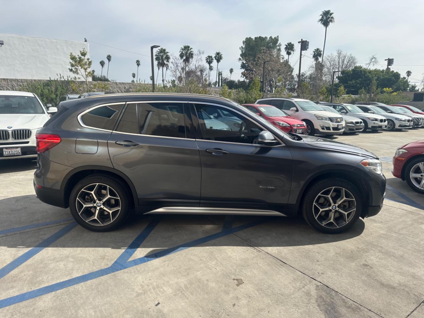 2016 Gray /Black BMW X1 leather (WBXHT3Z34G4) with an 4 CYLINDER engine, Automatic transmission, located at 30 S. Berkeley Avenue, Pasadena, CA, 91107, (626) 248-7567, 34.145447, -118.109398 - Crown City Motors is a used “Buy Here Pay Here” car dealer in Pasadena CA. “Buy Here Pay Here” financing, means that when you purchase your vehicle from our dealership, that you make the payments to the dealership as well. We do not need the banks approval to get you approved for a used auto - Photo#6